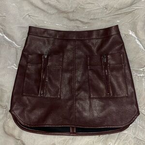 BCBG Bordeaux wine colored, Vegan leather mini skirt new with tags XS